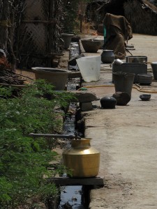 1024px-India_-_Rural_-_03_-_drinking_water_and_waste_water_meet_on_the_street_(2564575360)