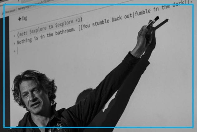 Mark Sample pointing to code on a projected image. 